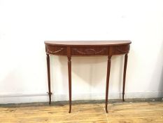 A narrow Adam style console table, with reeded edge over a Neoclassical decorated frieze, with