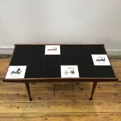 A 1960s teak framed coffee table, the rectangular top inset with black tiles interspersed with tiles