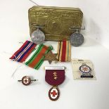 A mixed lot including a Princess Mary Christmas tin (3cm x 13cm x 8cm), a WWII Defence medal, a