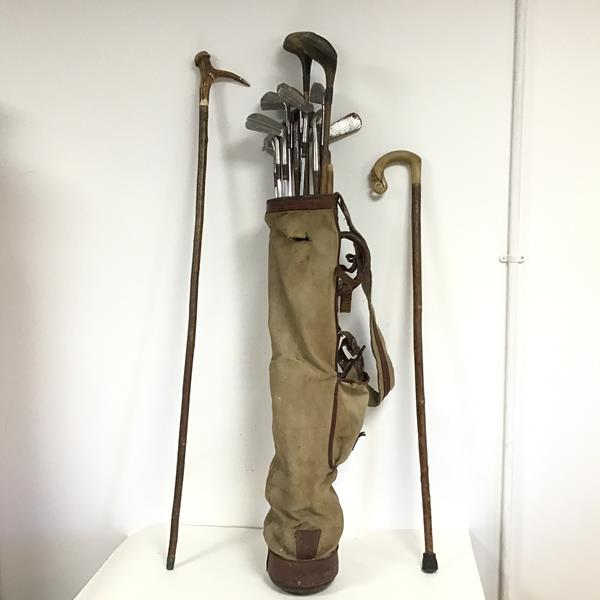A set of vintage golf clubs with irons from Henry Cotton, W Gibson and others, along with two