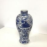 An early 20thc Chinese blue and white baluster vase depicting Two Men flanking a large Lidded