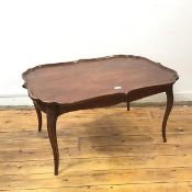 A 1920s/30s reproduction Georgian style occasional table, the rectangular top with undulating