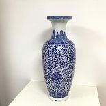 A Chinese floor standing baluster vase with a dished rim, with traditional decoration, with
