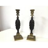 A pair of cast brass candlesticks of classical inspired design, with the stem in the form of