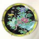 A large Chinese dish with a yellow border surrounding a Mythical Beast in a Jungle (d.37cm)