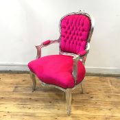 An early 20thc silvered fauteuil, the moulded frame with floral crest above a button upholstered