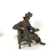 A bronzed spelter figure of Shakespeare seated with Pen and Book in Hand (h.33cm x 27cm x 16cm)