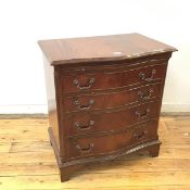 A reproduction Georgian style serpentine chest of drawers, the rectangular crossbanded top with