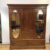 A late Victorian mahogany and chequer banded wardrobe, the projecting cornice and chequer inlaid