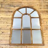 A conservatory style mirror, the single glass behind a wooden frame, bears a Juckes Ltd. Wrex Mirror