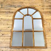 A conservatory style mirror, the single glass behind a wooden frame, bears a Juckes Ltd. Wrex Mirror
