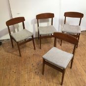 A set of four late 1960s teak dining chairs, each with slightly curved tablet top rail above an