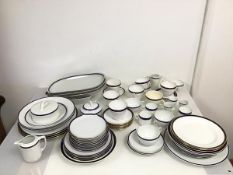 A mixed lot including dinner plates, side plates, serving plates, tea cups, demi tasse cups, egg