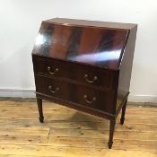 An early 20thc mahogany fall front bureau, the rectangular top enclosing two drawers and pigeon