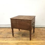 A William IV mahogany and ebony lined commode, the hinged top with brass carry handles, enclosing