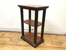 An Edwardian mahogany and ebonised stand, the rectangular top above a middle tier with reeded edge