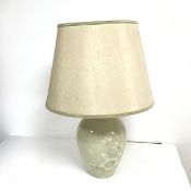 A ceramic table lamp with floral decoration complete with shade (h.60cm)