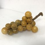 An alabaster grape table ornament, each grape formed from alabaster and glazed, some losses to
