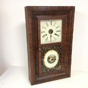 An early 20thc wall hanging clock of rectangular form, with a hinged two panel door, the top clear