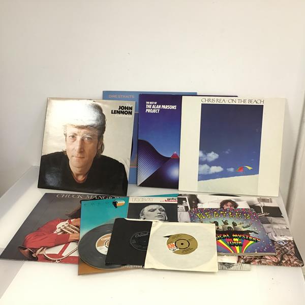 A collection of vinyl records including John Lennon, Dire Straits, Chuck Mangione etc. (a lot)