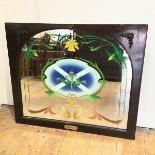 A mahogany framed pub mirror, with reverse painted stylised daffodil around a saltire with central