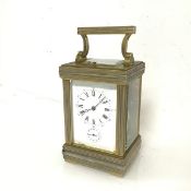 A four glass carriage clock with additional glass to top, the enamelled dial with roman numerals for