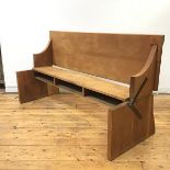 Fettes College Interest: an unusual metamorphic oak hall bench/desk, early 20thc., the hinged top