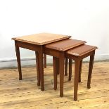 A set of three teak graduated tables by Stag, each with rectangular top and moulded edge, raised