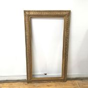 A gilt composite frame with foliate decoration (145cm x 83cm)