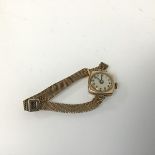 A 9ct gold lady's wristwatch, on a 9ct gold milanese style adjustable strap (9cm) (16.63g)