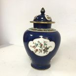 A 1920s/30s Staffordshire lidded vase of urn form in the Worcester Blue scale style, lid with