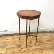 An Edwardian satinwood and ebony lined occasional table, c.1900, the octagonal top raised on slender