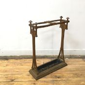 An Art Nouveau cast iron stick stand, c.1900, the patinated gilt frame incorporating stylised floral