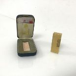 A Dunhill gilt metal lighter with original box (6.5cm x 2.5cm)