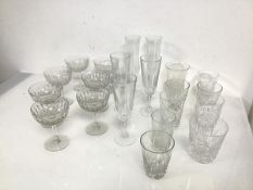 A set of seven crystal champagne coupes (h.11cm x d.8cm), five champagne flutes and nine