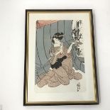 A Japanese woodcut, Lady Holding a Fan and Pipe, characters bottom right, label verso inscribed