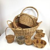 An assortment of wicker ware including baskets and dishes (largest: 30cm x 66cm x 44cm) (12)