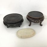 A Chinese circular pierced jardiniere stand, with four scrolled supports (11cm x d.20cm) and another