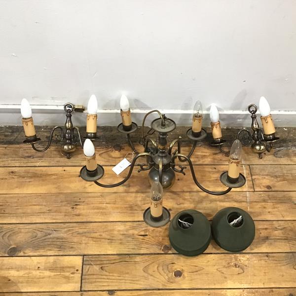 A five arm Dutch style chandelier with two matching two arm wall sconces with green shades (