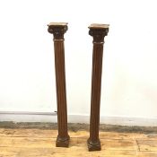 A pair of 19thc carved oak Ionic columns, formerly part of a larger piece of furniture, the carved