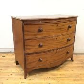 A late George III mahogany bow front chest, c.1800, the rectangular top with moulded edge above