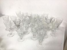 A large assortment of stem glassware including sherry glasses, port glasses, cordial glasses etc.,