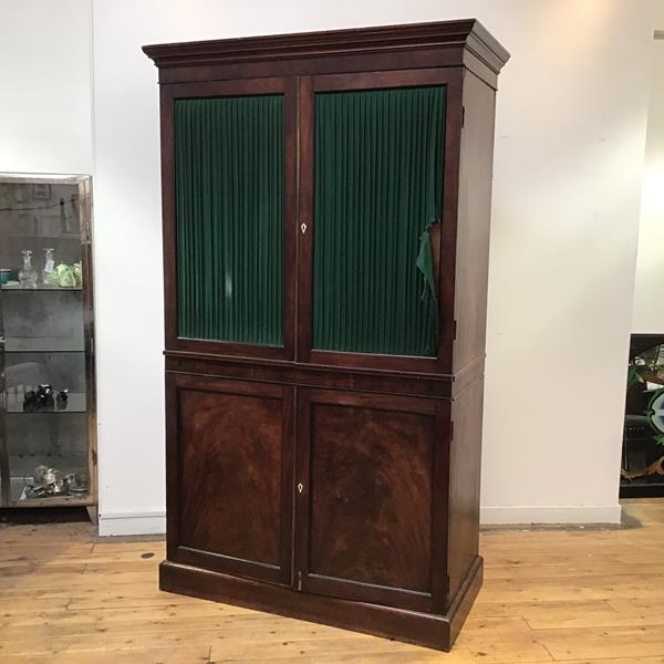 Harewood House interest: a late George III mahogany and ebony lined cabinet, the projecting