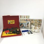 A 1960s Meccano kit and a later additional kit together with a large collection of cigarette cards