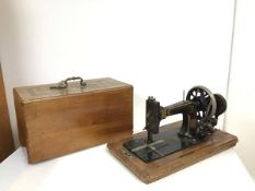 An early 20thc hand powered table top Frister & Rossmann sewing machine, the machine decorated
