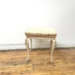 A Louis XV style stool, the rectangular upholstered seat in a neoclassical design, on four