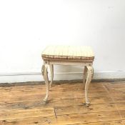 A Louis XV style stool, the rectangular upholstered seat in a neoclassical design, on four