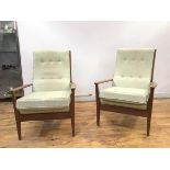 A pair of Cintique armchairs with green tone geometric pattern upholstery, the button backs over a