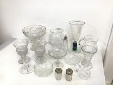 An assortment of glass and crystal including vases, a water pitcher, a sugar castor, a tazza,