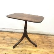 A Regency mahogany tripod table, the hinged top with reeded edge on a baluster shaft and downswept